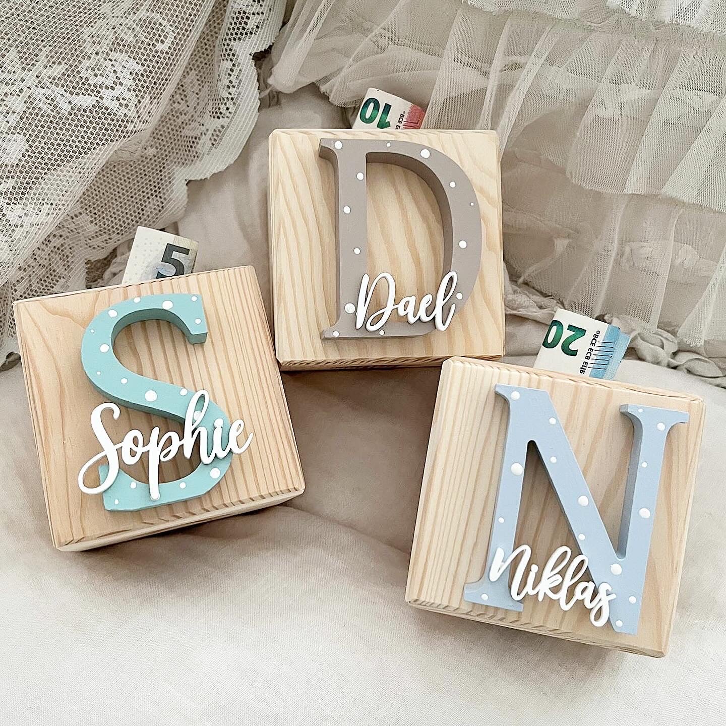 Money box cube letters dots